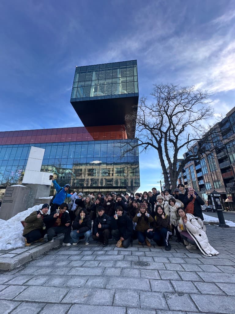Friends gathered outside the library in winter